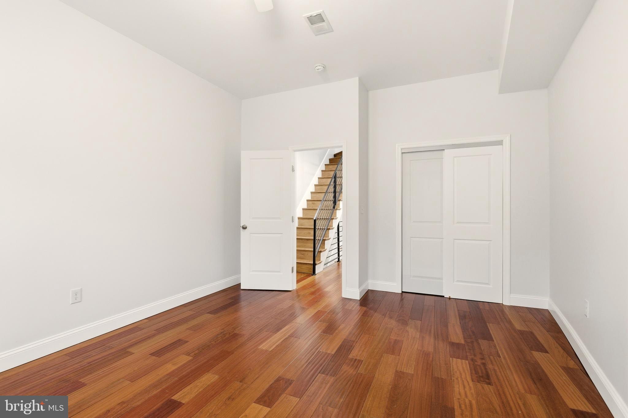 909 North 4th Street Philadelphia, PA 19123 - Photo 13 of 24 an empty room with wooden floor and closet