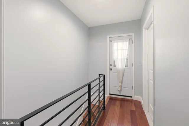 a bathroom with a shower sink mirror and toilet