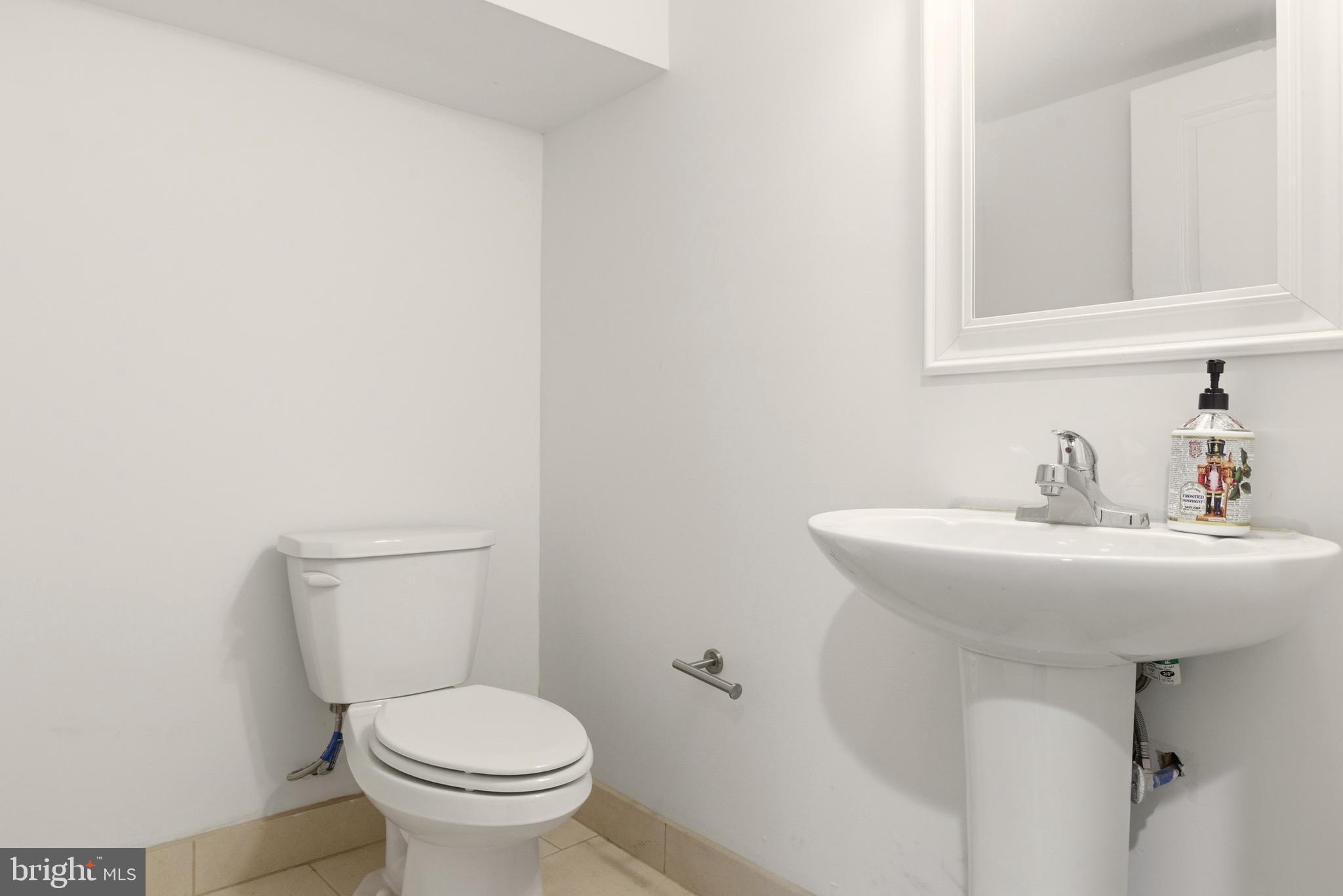 909 North 4th Street Philadelphia, PA 19123 - Photo 19 of 24 a bathroom with a sink and a toilet