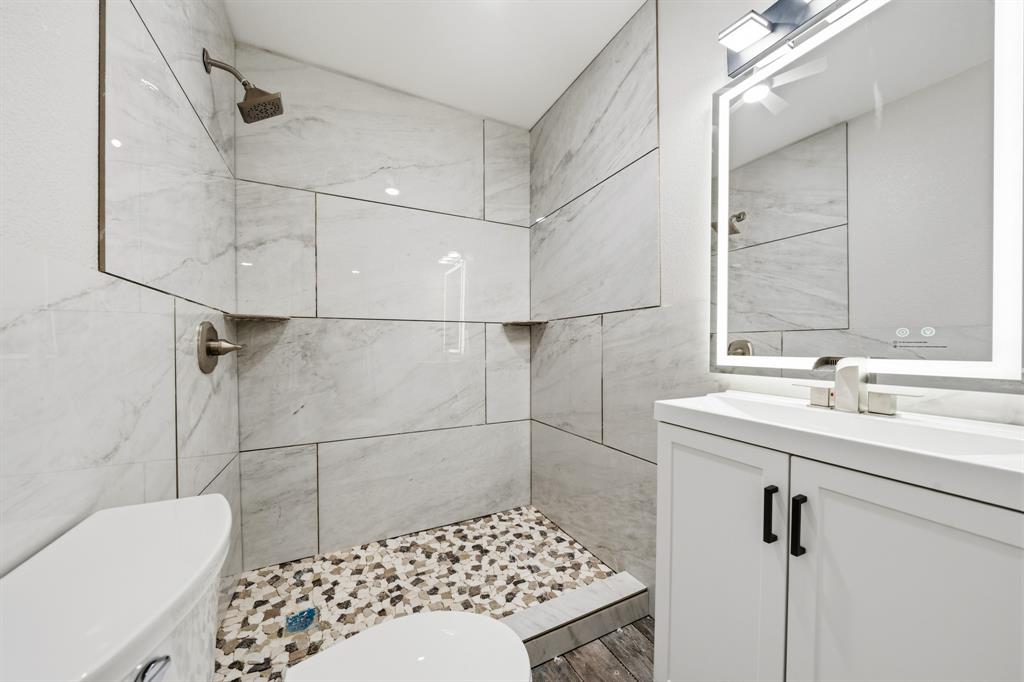 3313 South 3rd Street Waco, TX 76706 - Photo 17 of 28 a bathroom with a sink toilet and shower