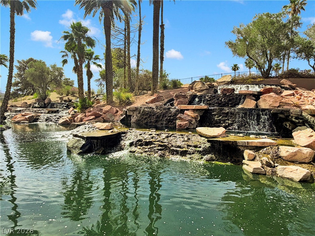 8981 Rivers Edge Drive Las Vegas, NV 89117 - Photo 55 of 69 Lush landscaping and flowing waterfalls create a tranquil, resort-like environment.