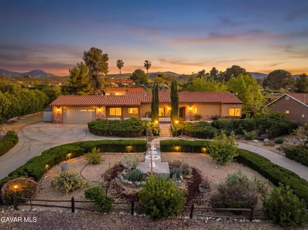 an aerial view of a house with a garden