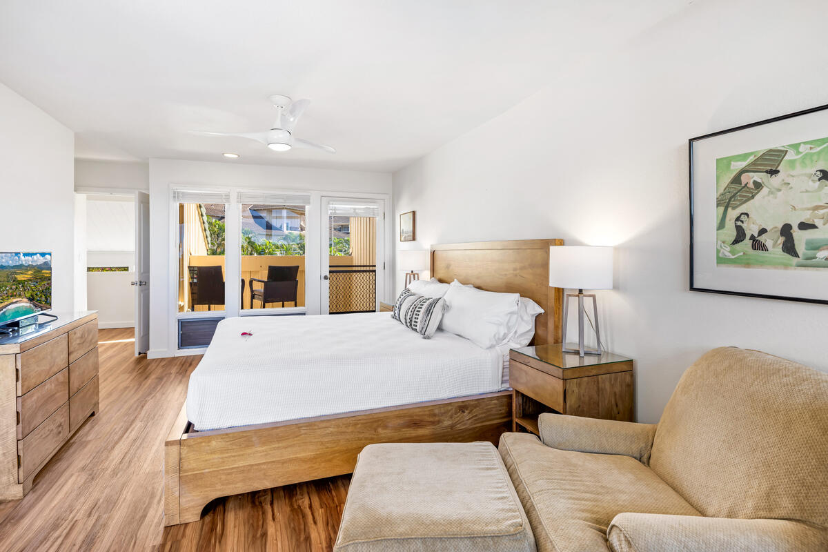 2371 Ho'ohu Road, Unit 703 Koloa, HI 96756 - Photo 17 of 27 a bed room with a bed and a large window