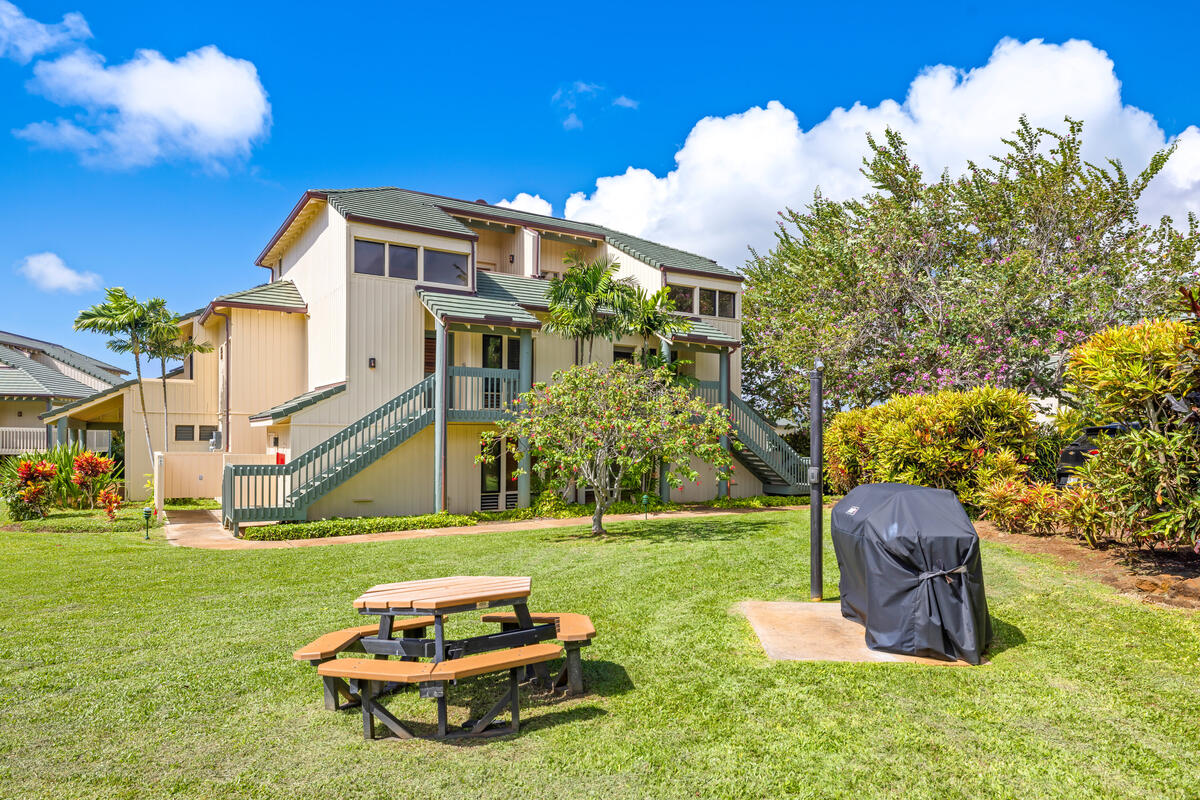 2371 Ho'ohu Road, Unit 703 Koloa, HI 96756 - Photo 18 of 27 a front view of a house with garden