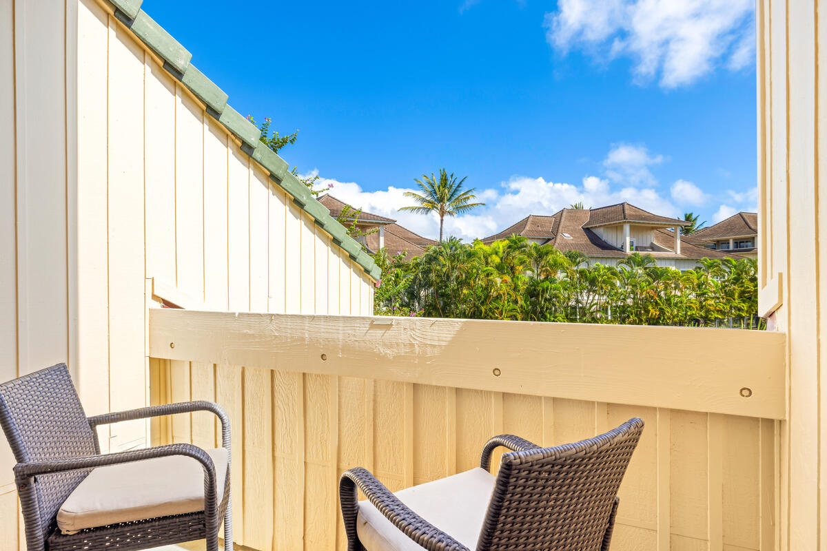 2371 Ho'ohu Road, Unit 703 Koloa, HI 96756 - Photo 20 of 27 a view of a two chairs in the balcony