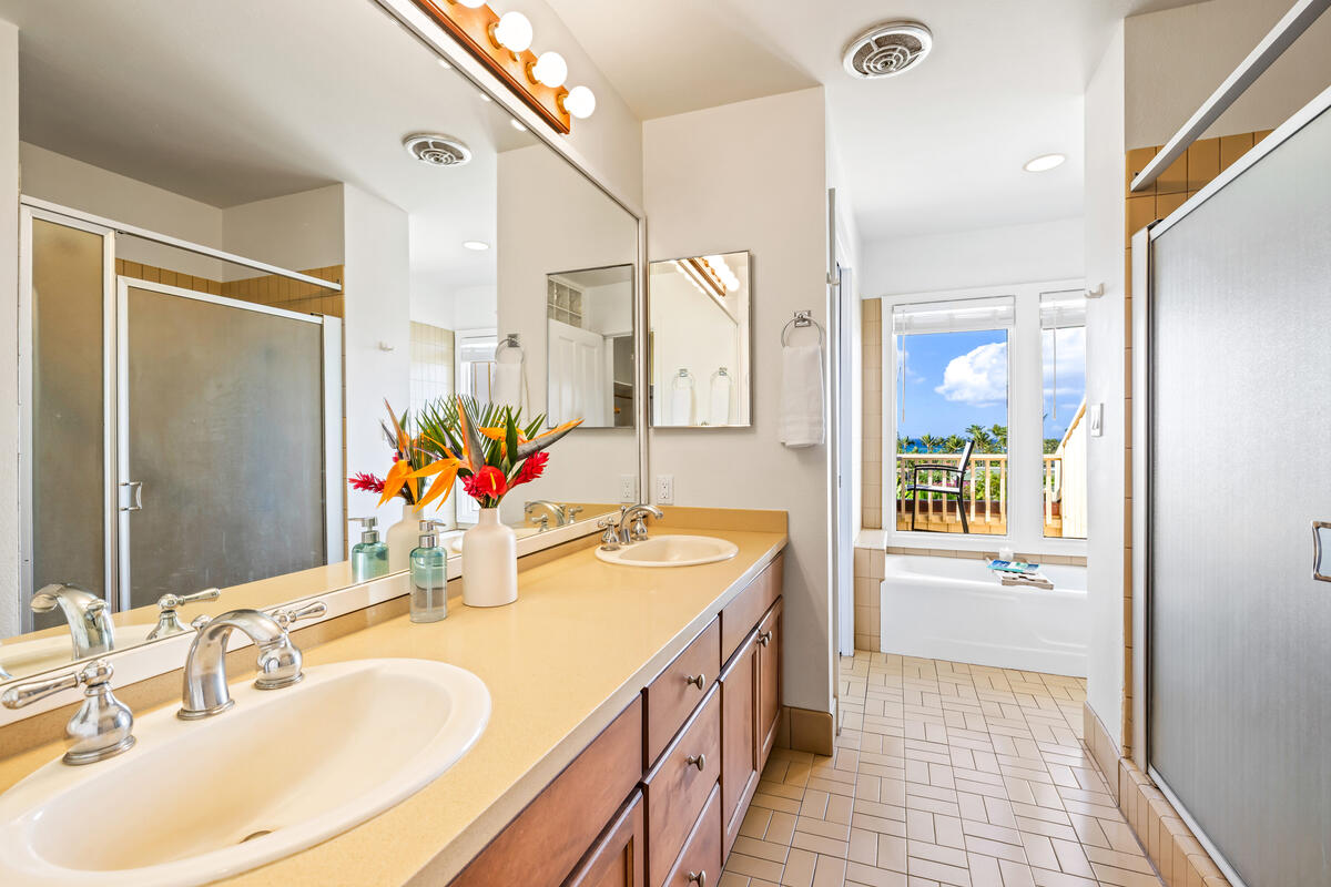 2371 Ho'ohu Road, Unit 703 Koloa, HI 96756 - Photo 21 of 27 a bathroom with a sink double vanity and a mirror