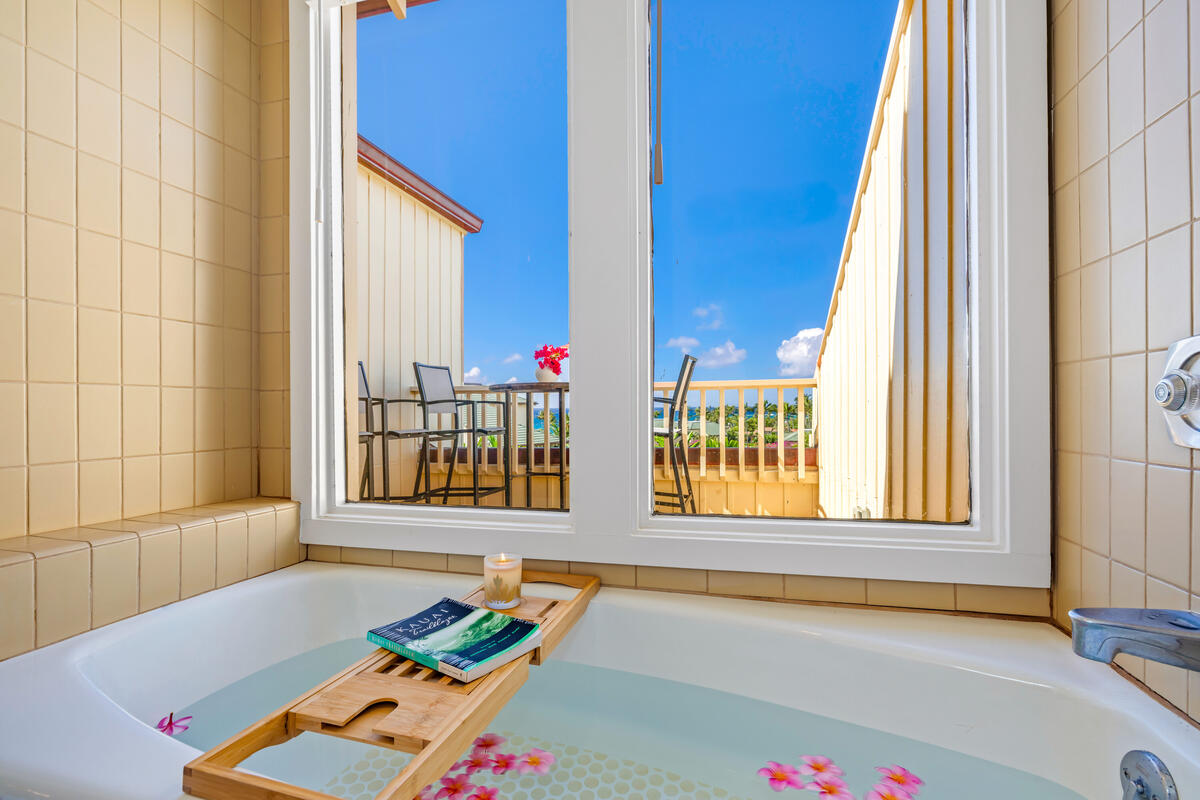 2371 Ho'ohu Road, Unit 703 Koloa, HI 96756 - Photo 22 of 27 a view of front door with lounge chair and next to a window