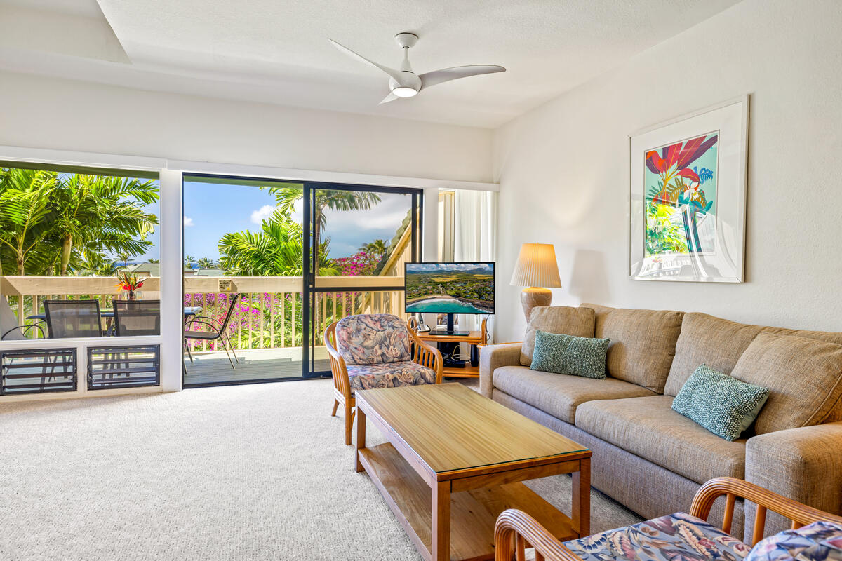 2371 Ho'ohu Road, Unit 703 Koloa, HI 96756 - Photo 5 of 27 a living room with furniture and a flat screen tv