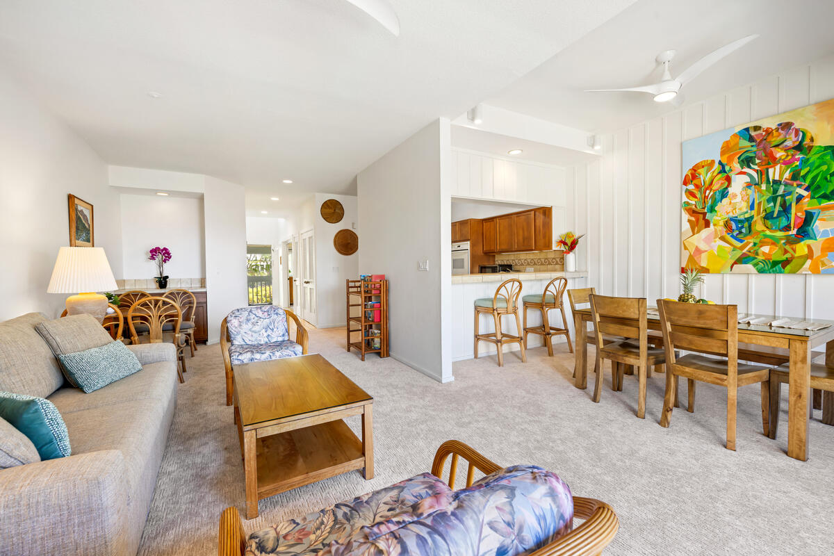 2371 Ho'ohu Road, Unit 703 Koloa, HI 96756 - Photo 8 of 27 a living room with furniture and wooden floor