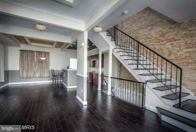 a view of entryway with wooden floor