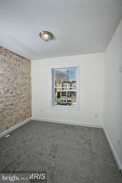 3616 Reisterstown Road Baltimore, MD 21215 - Photo 17 of 26 an empty room with windows