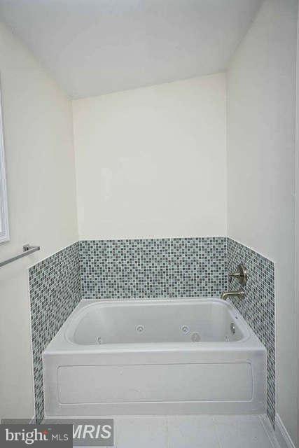 3616 Reisterstown Road Baltimore, MD 21215 - Photo 18 of 26 a bathroom with a bathtub