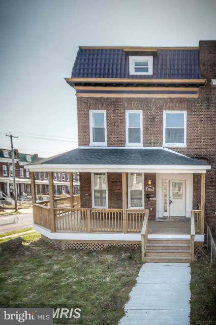 3616 Reisterstown Road Baltimore, MD 21215 - Photo 3 of 26 a front view of a house with a yard
