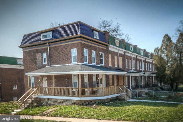 3616 Reisterstown Road Baltimore, MD 21215 - Photo 4 of 26 a front view of a house with a yard