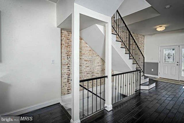 3616 Reisterstown Road Baltimore, MD 21215 - Photo 9 of 26 a view of staircase with wooden floor and white walls