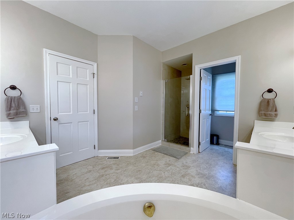 718 Sunridge Road Fairlawn, OH 44333 - Photo 18 of 49 Bathroom featuring separate shower and tub and vanity