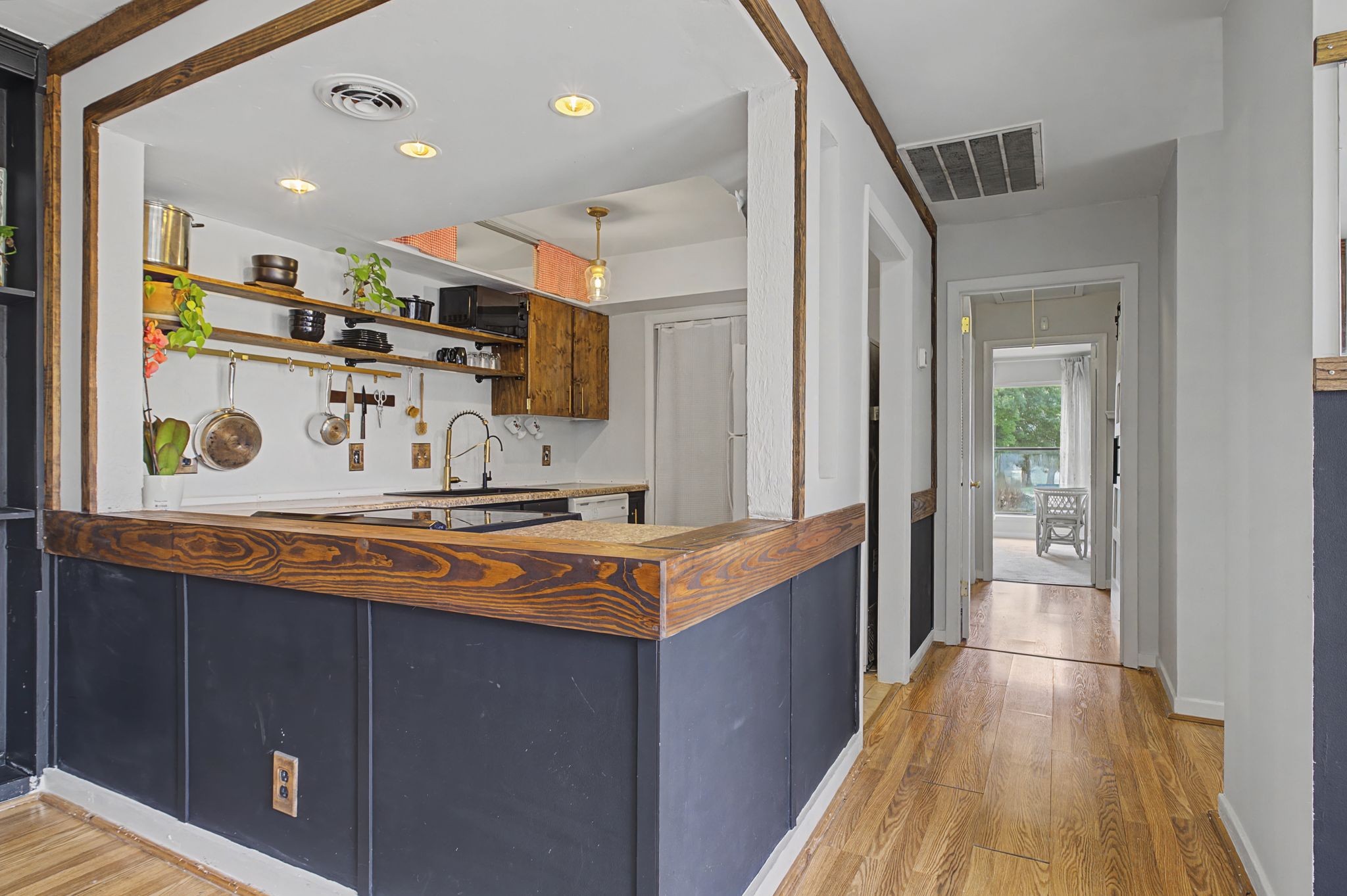 218 Harpers Mill Road Hermitage, TN 37076 - Photo 13 of 29 a kitchen with stainless steel appliances granite countertop a sink stove and wooden cabinets