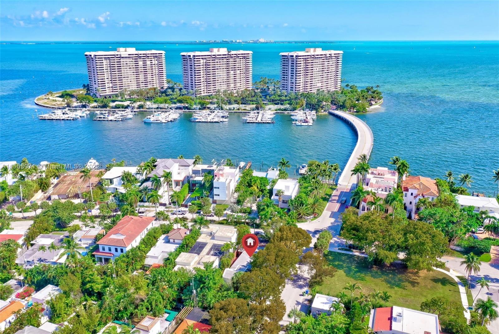 3571 Fair Isle Street Miami, FL 33133 - Photo 1 of 38 a view of a lake with a building in the background