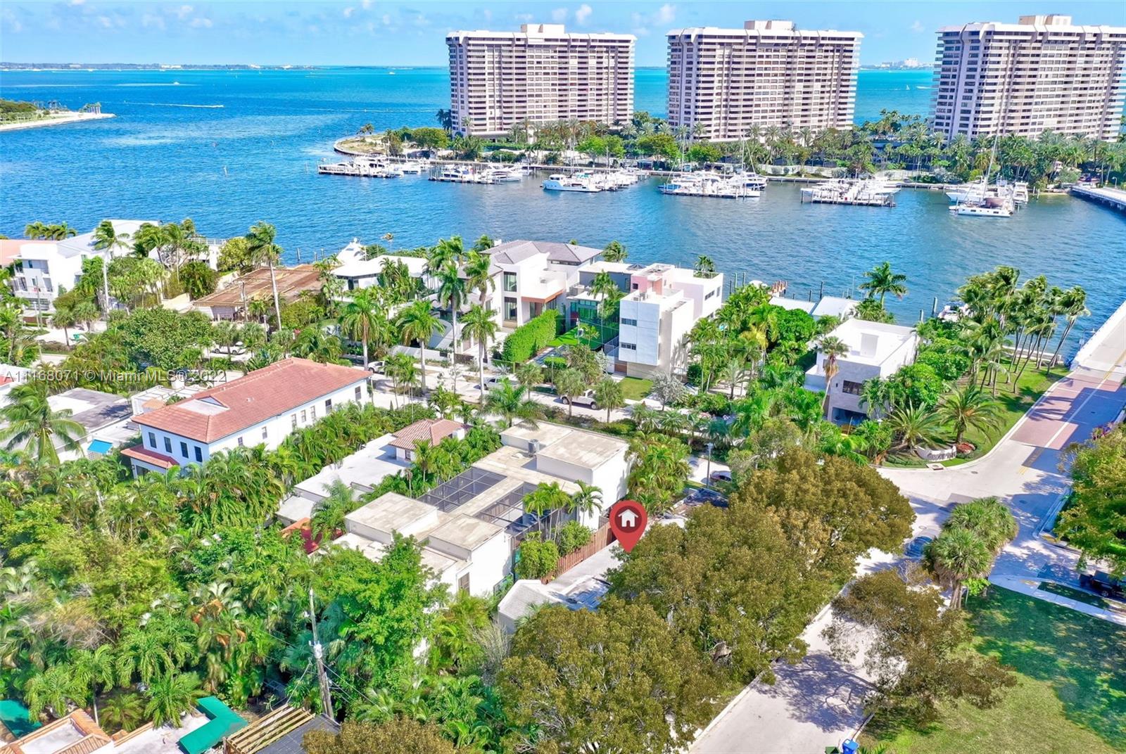 3571 Fair Isle Street Miami, FL 33133 - Photo 19 of 38 a view of a lake with a building in the background