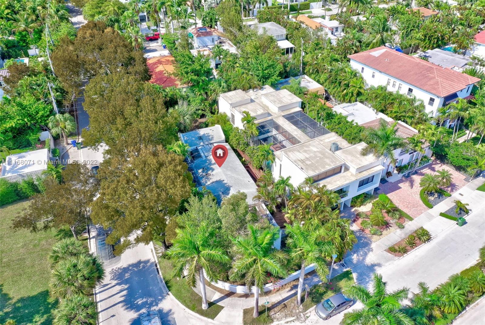 3571 Fair Isle Street Miami, FL 33133 - Photo 21 of 38 an aerial view of a house with a yard and garden