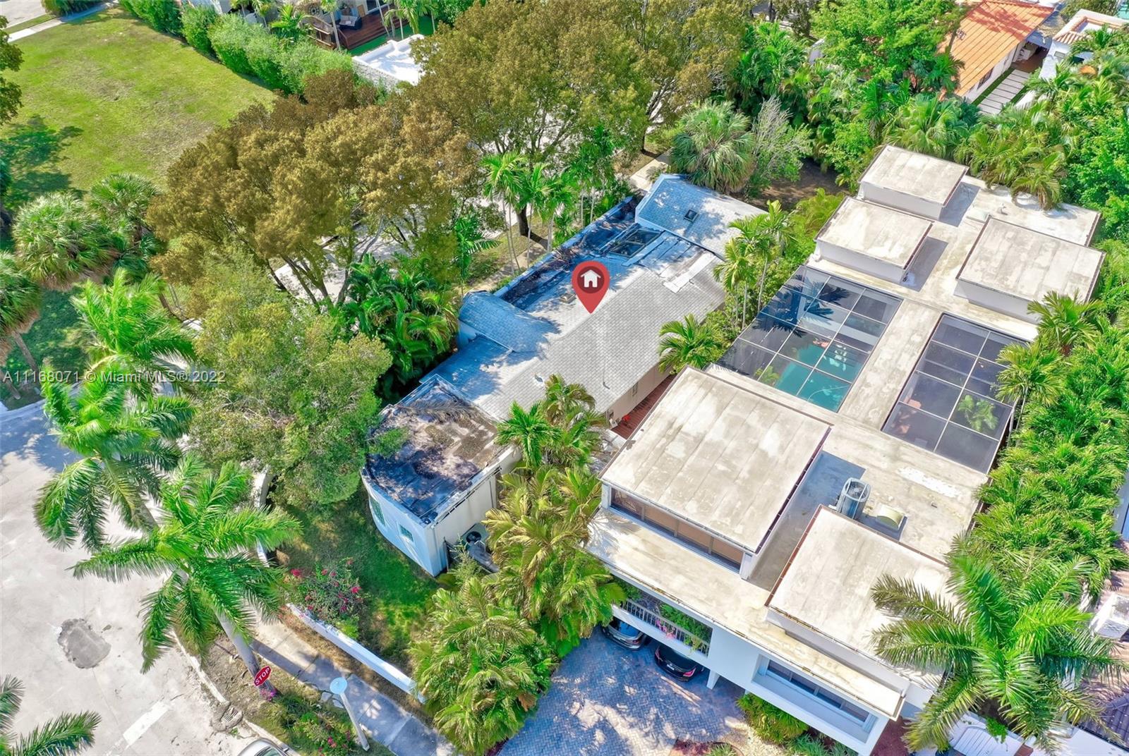 3571 Fair Isle Street Miami, FL 33133 - Photo 24 of 38 an aerial view of a house with a yard and garden