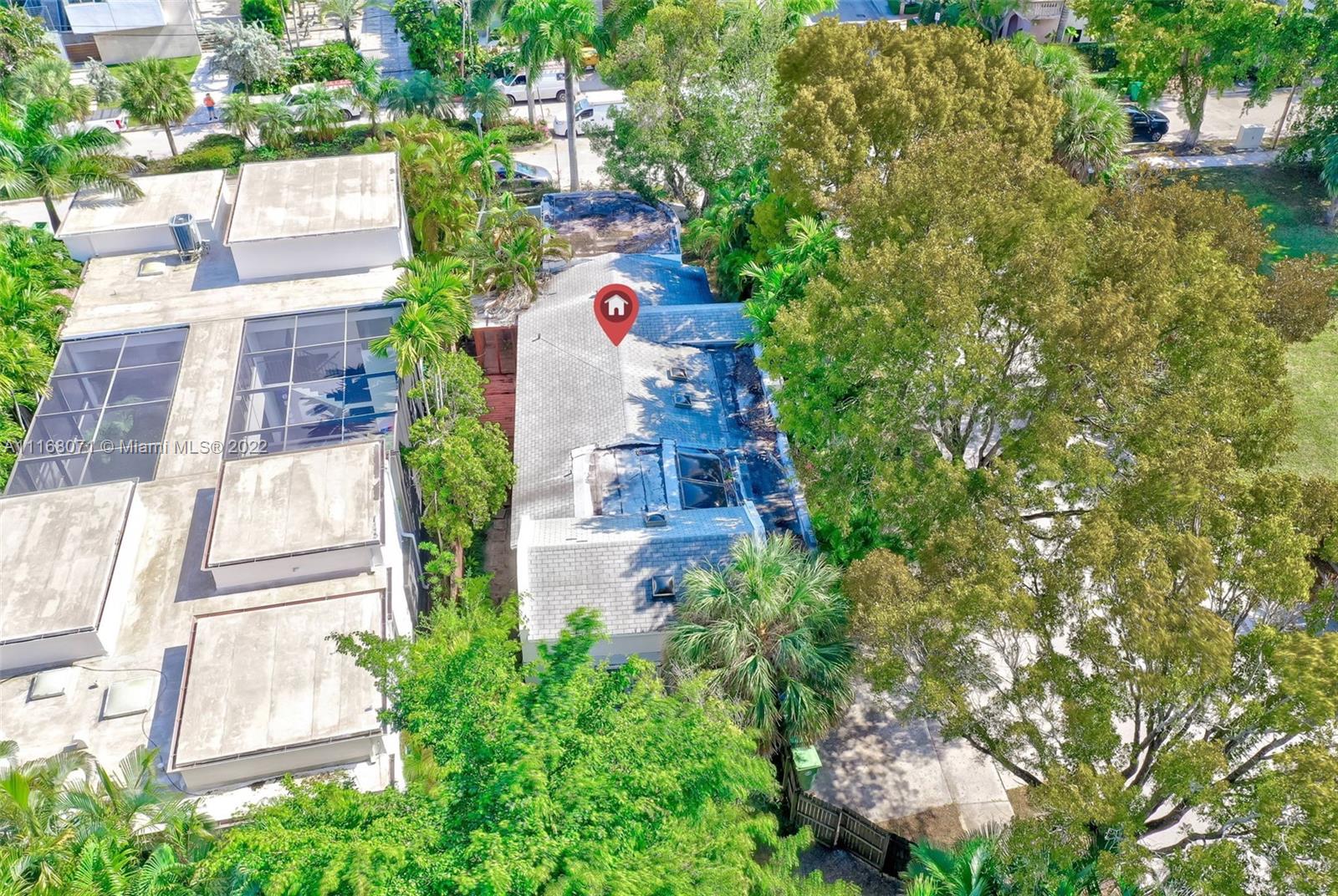 3571 Fair Isle Street Miami, FL 33133 - Photo 28 of 38 an aerial view of a house with a yard and garden