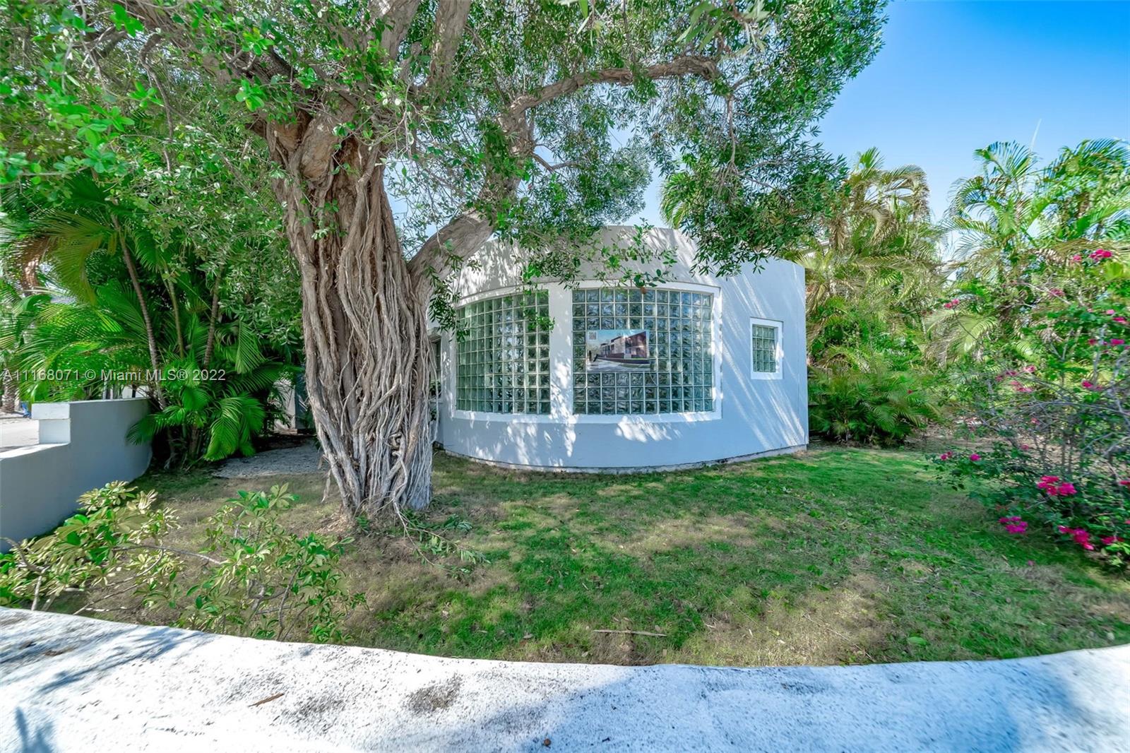 3571 Fair Isle Street Miami, FL 33133 - Photo 35 of 38 a view of a wooden fence