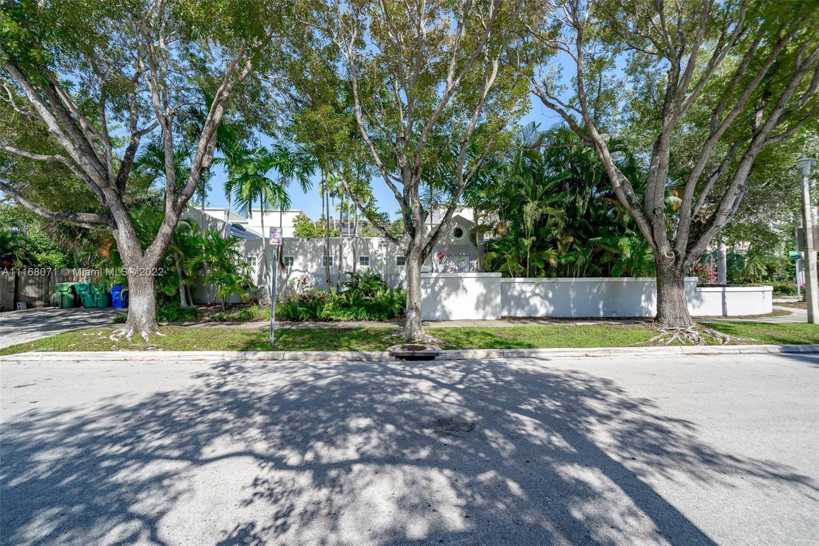 3571 Fair Isle Street Miami, FL 33133 - Photo 38 of 38 a view of a yard with plants and trees