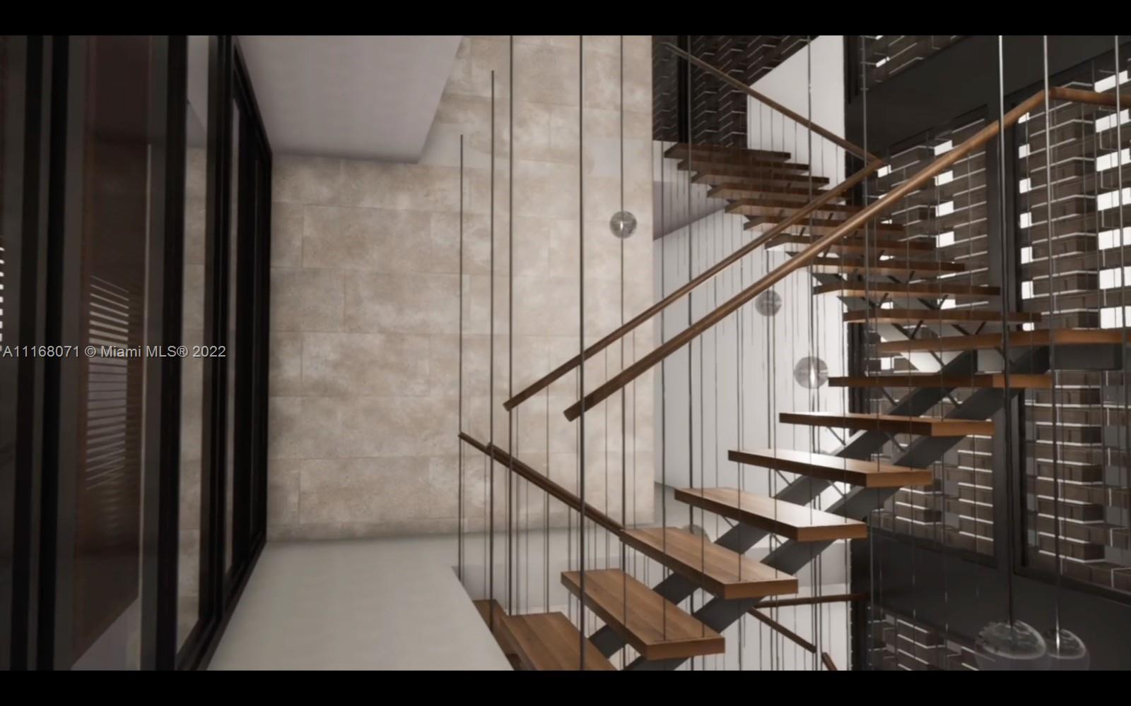 3571 Fair Isle Street Miami, FL 33133 - Photo 5 of 38 a view of entryway and hall with wooden floor