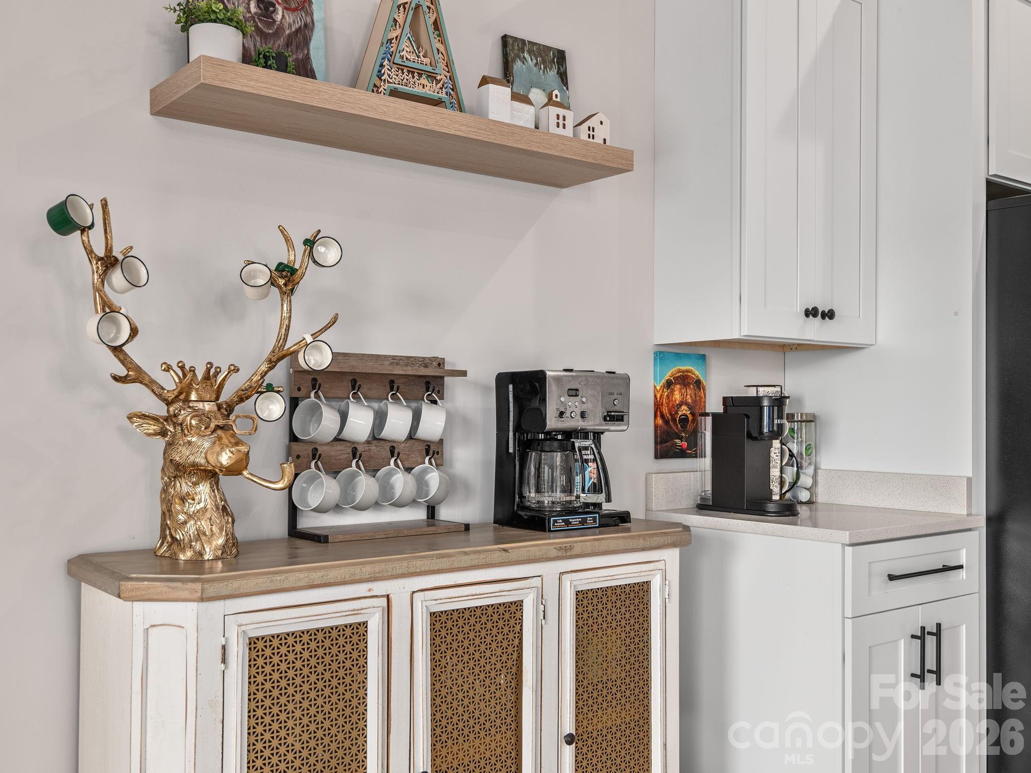 2201 Bulling Creek Road Hendersonville, NC 28739 - Photo 13 of 47 a kitchen with a refrigerator and cabinets