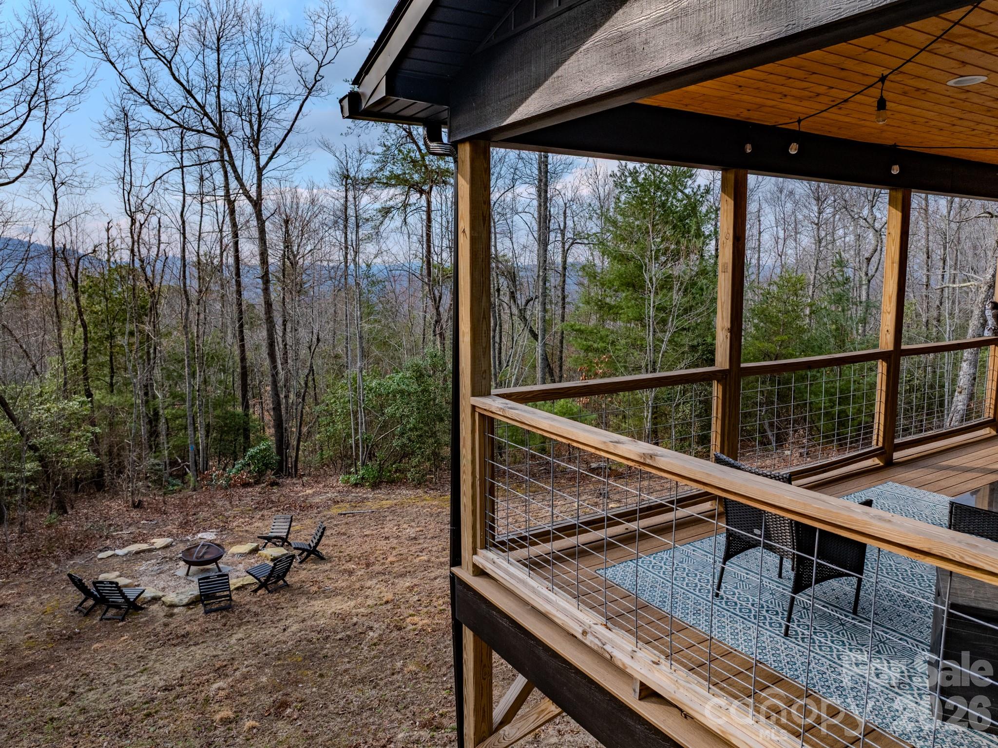 2201 Bulling Creek Road Hendersonville, NC 28739 - Photo 17 of 47 a view of a two chairs in the deck