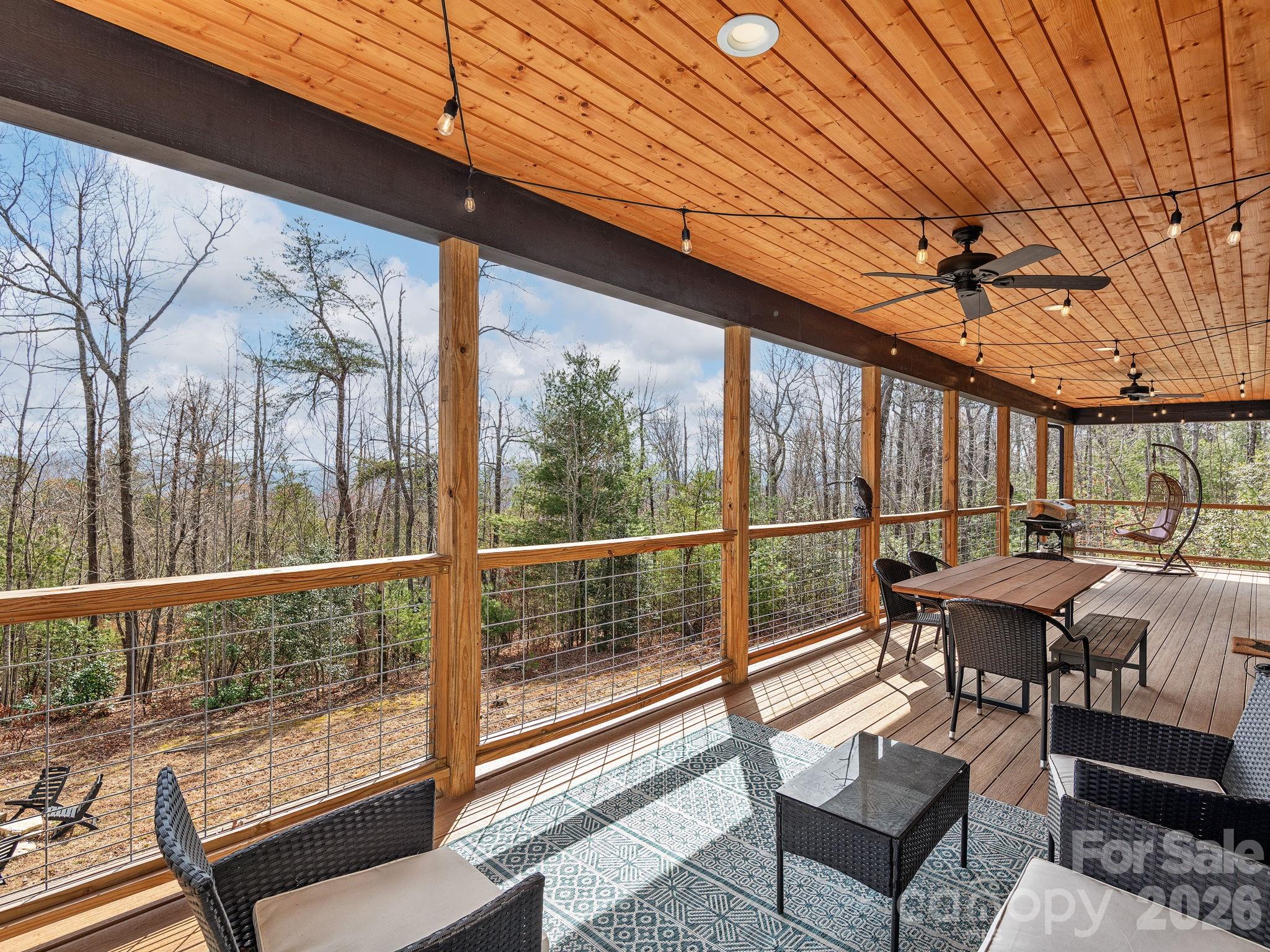 2201 Bulling Creek Road Hendersonville, NC 28739 - Photo 19 of 47 a view of a chairs and table in the balcony