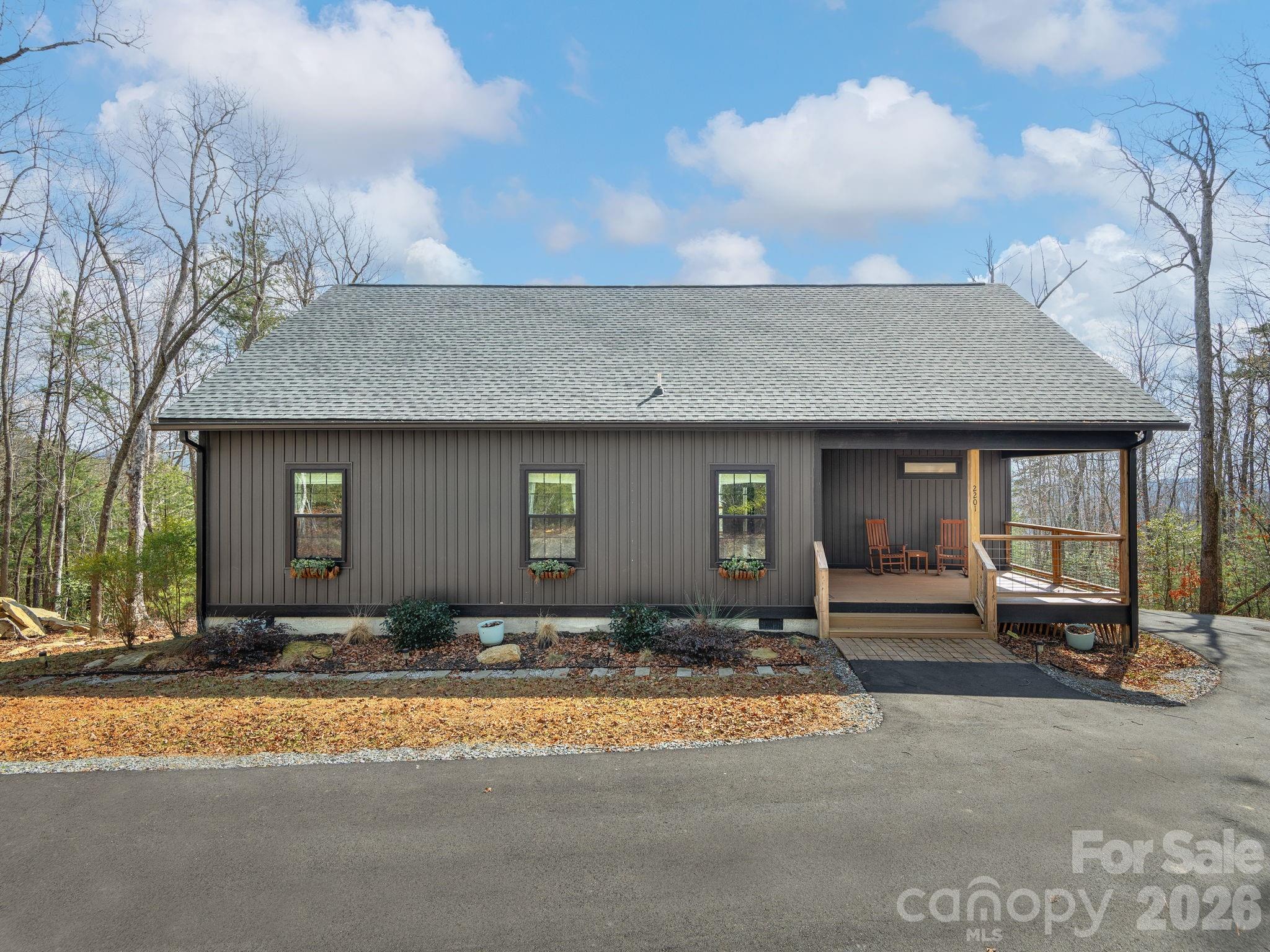 2201 Bulling Creek Road Hendersonville, NC 28739 - Photo 2 of 47 a front view of a house with a outdoor space