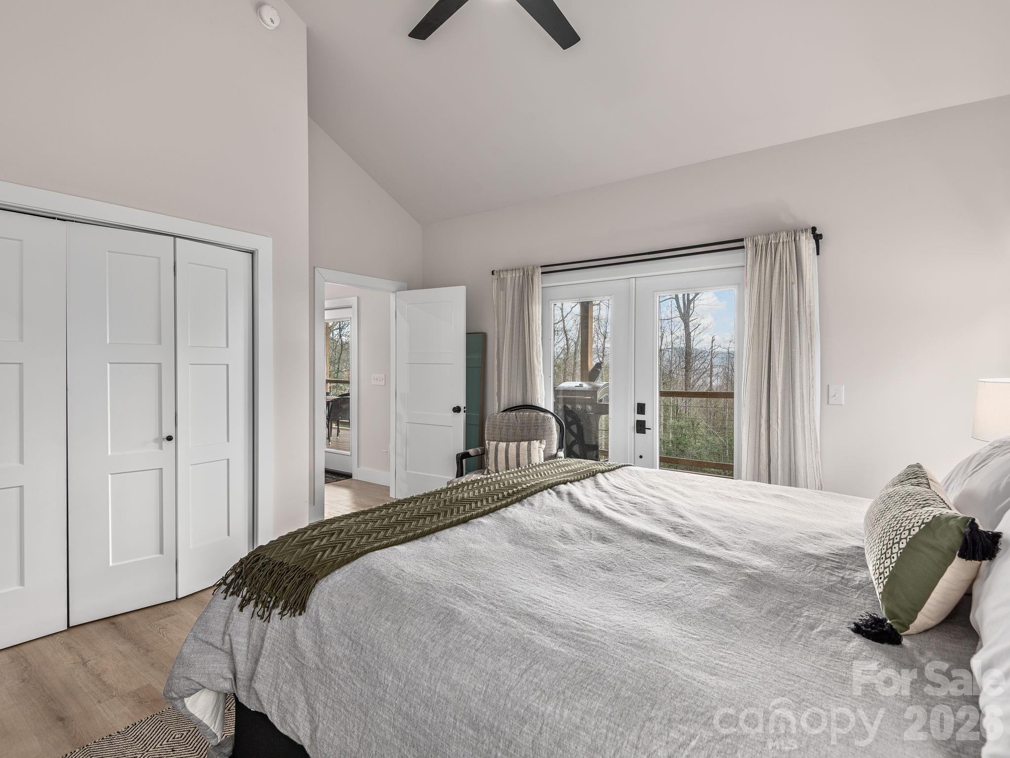 2201 Bulling Creek Road Hendersonville, NC 28739 - Photo 22 of 47 a bedroom with a bed and a painting on the wall