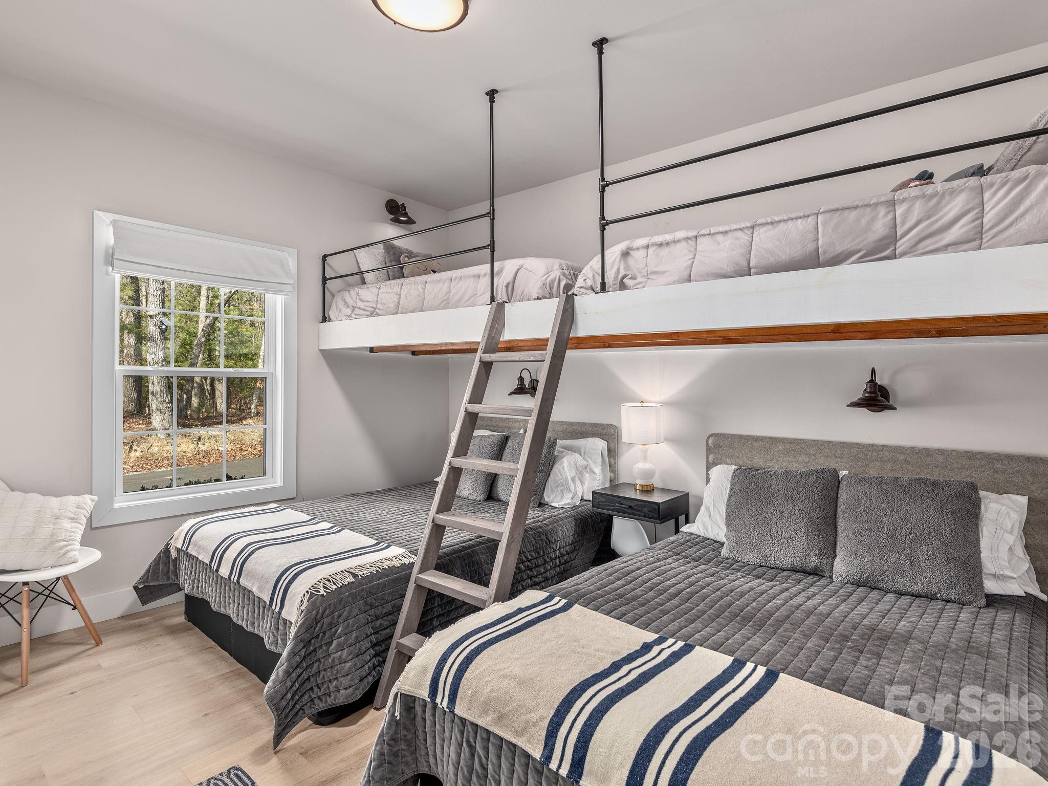 2201 Bulling Creek Road Hendersonville, NC 28739 - Photo 27 of 47 a bedroom with two beds and next to a window