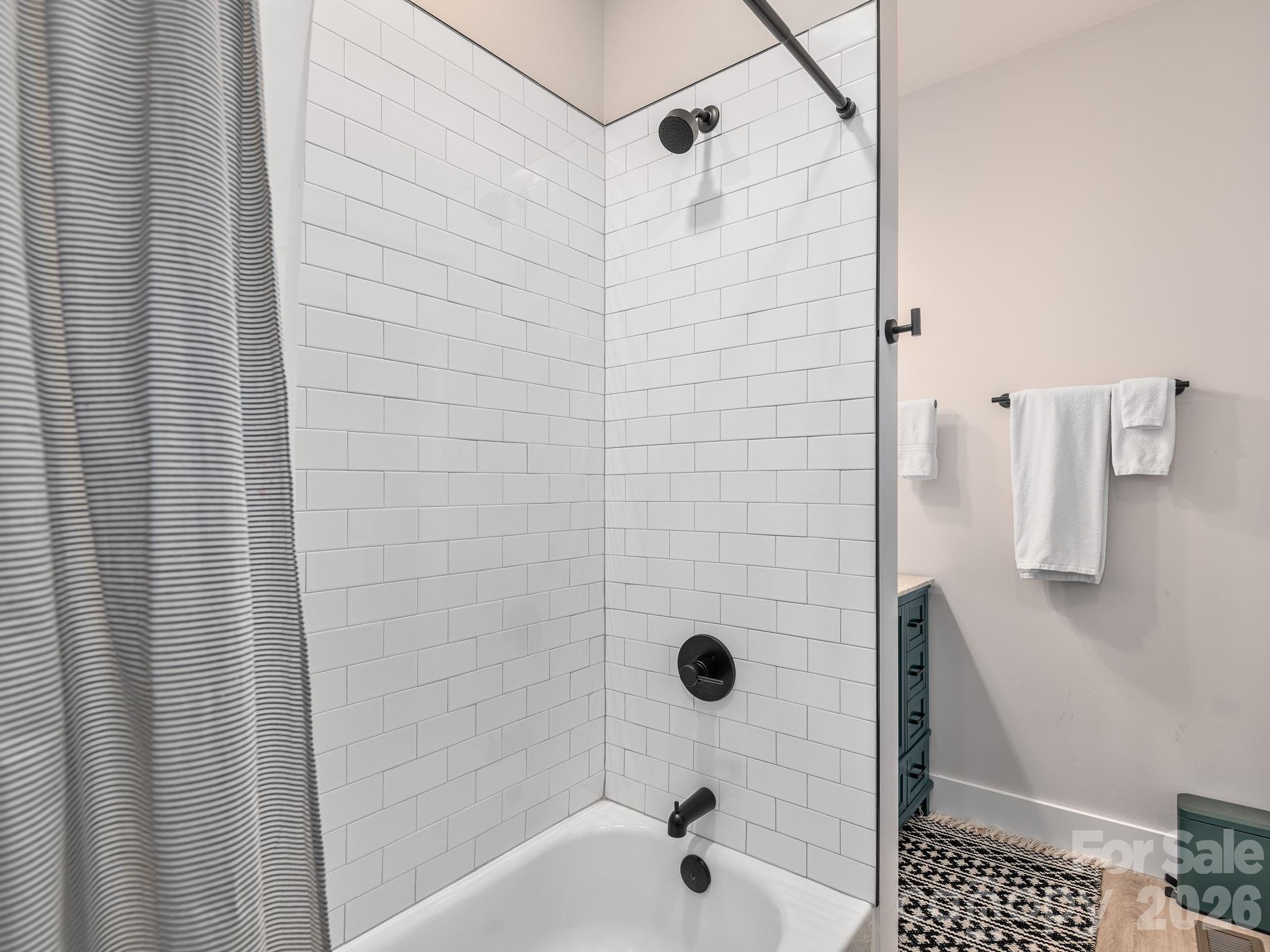 2201 Bulling Creek Road Hendersonville, NC 28739 - Photo 29 of 47 a bathroom with a shower and a toilet