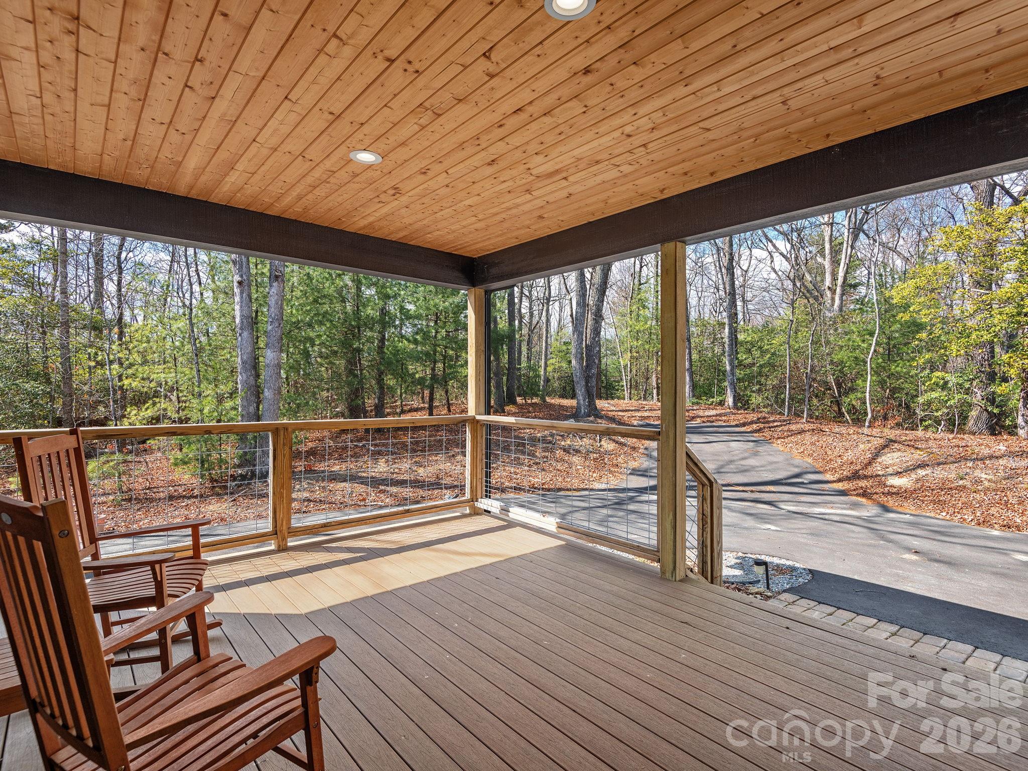 2201 Bulling Creek Road Hendersonville, NC 28739 - Photo 3 of 47 a view of a room with wooden floor and windows
