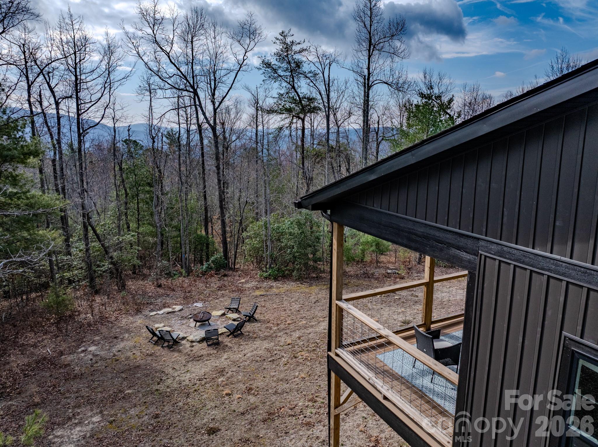 2201 Bulling Creek Road Hendersonville, NC 28739 - Photo 31 of 47 a view of backyard with green space and wooden fence
