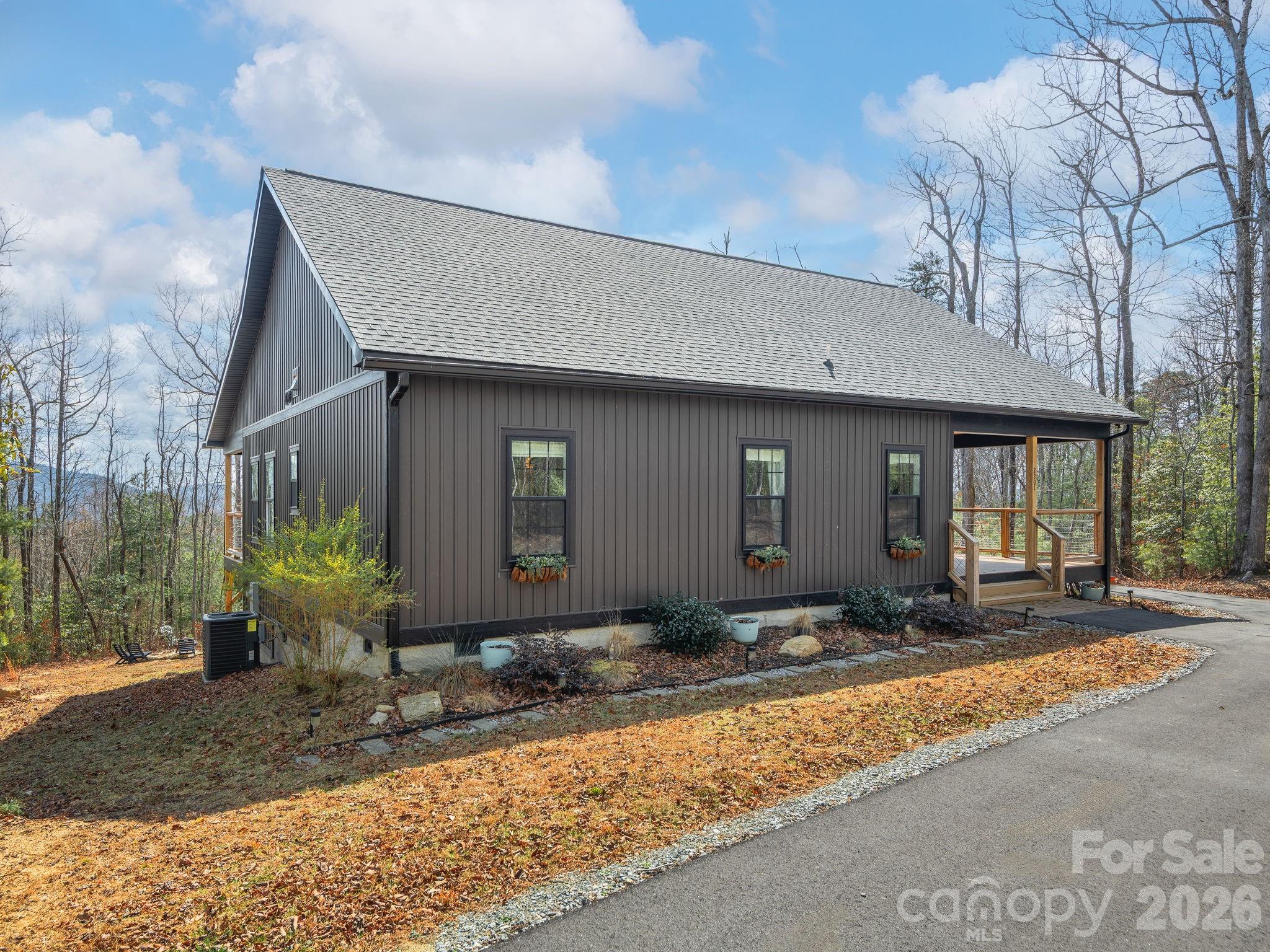 2201 Bulling Creek Road Hendersonville, NC 28739 - Photo 34 of 47 a front view of a house with garden