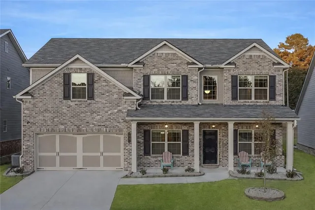 a front view of a house with outdoor seating yard