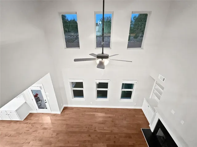 a view of kitchen with cabinets and wooden floor