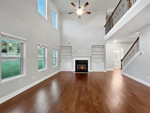 a view of kitchen with refrigerator and windows