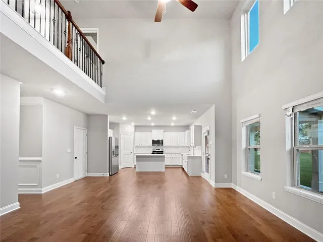 a view of entryway with stairs and wooden floor