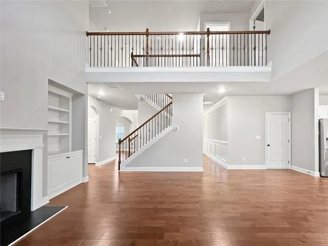 a view of an entryway with wooden floor
