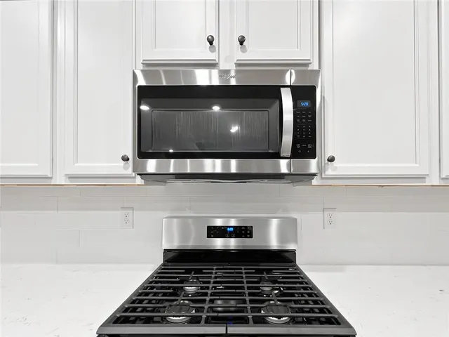 a kitchen with a sink and a window