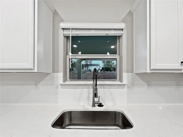 a view of kitchen with cabinets and wooden floor