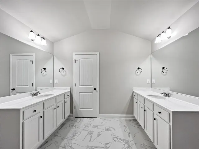 a bathroom with a bathtub and shower