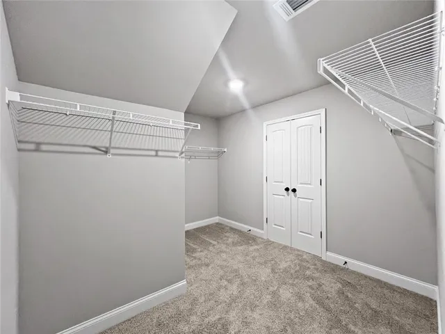 a spacious bathroom with a double vanity sink mirror and