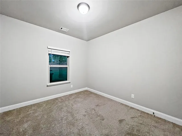 a bathroom with a toilet and a bathtub