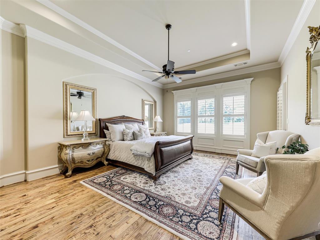 907 Foxglove Trail Fairview, TX 75069 - Photo 17 of 37 a living room with furniture and a chandelier